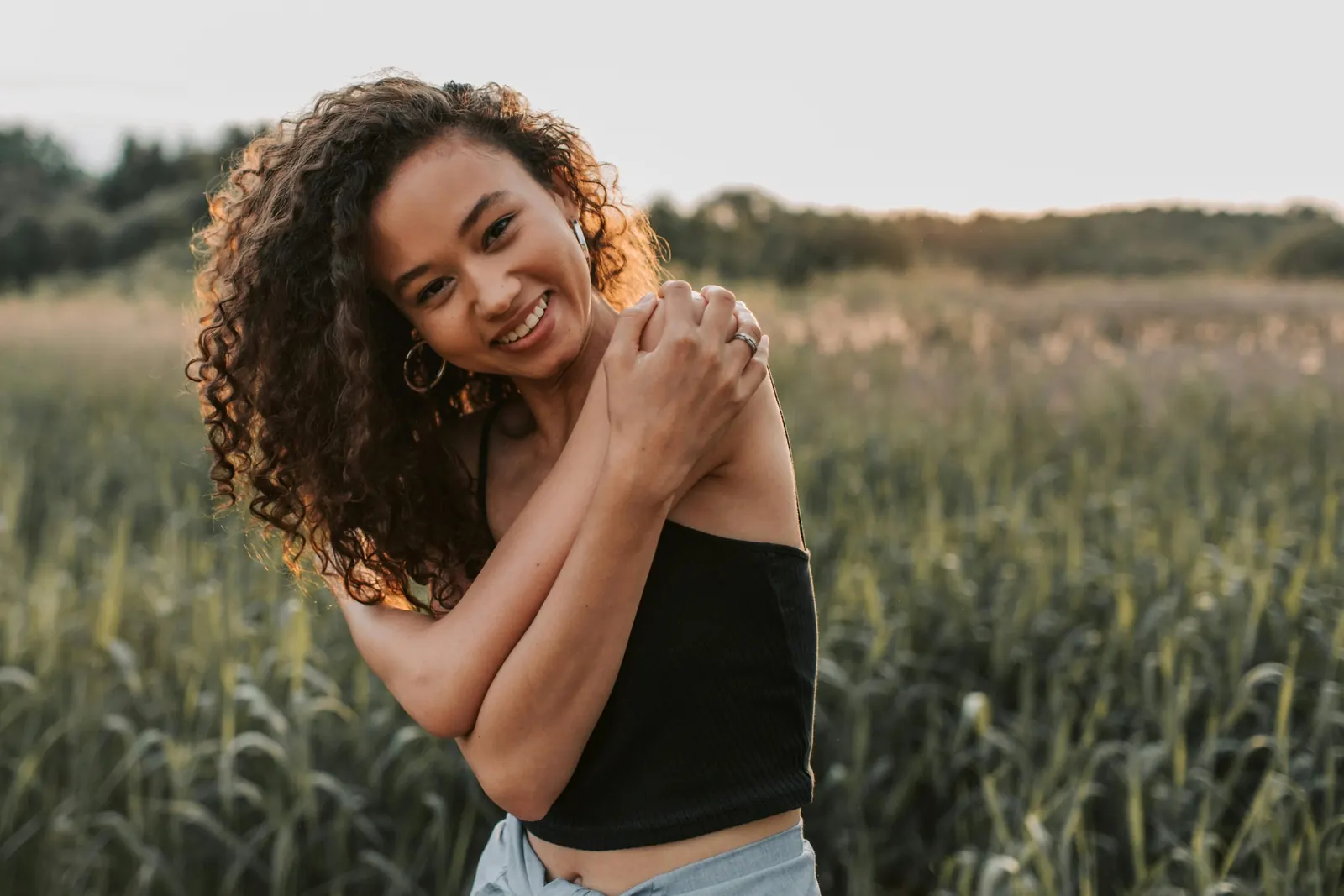 Woman smiling in a sunny field